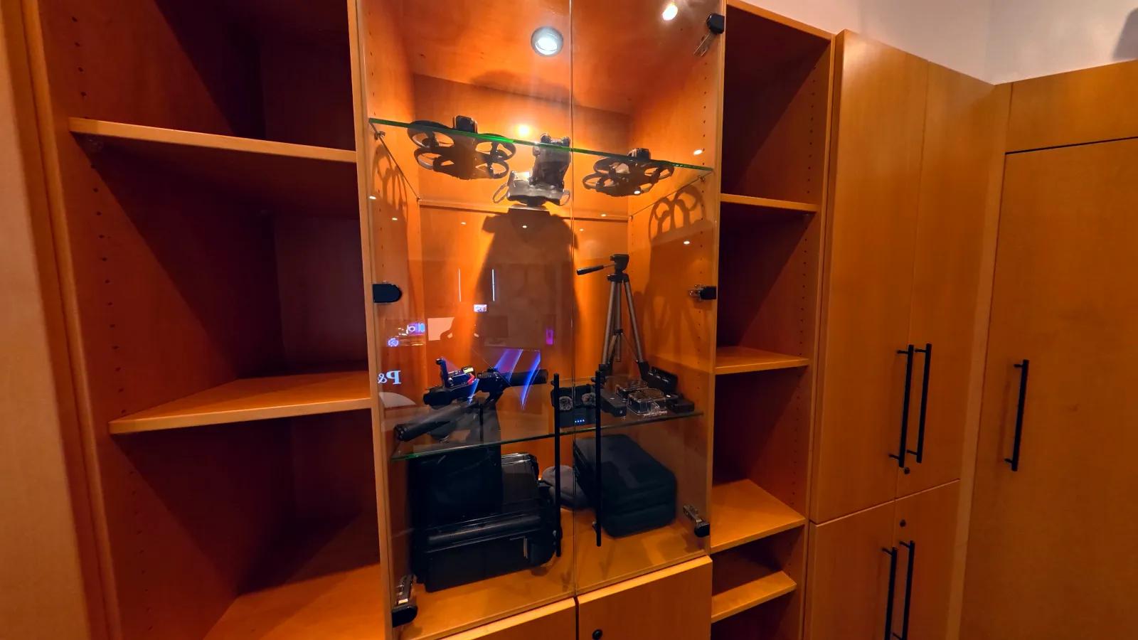 Still frame from the sample tour through our office: cabinet with drones, cameras and cases